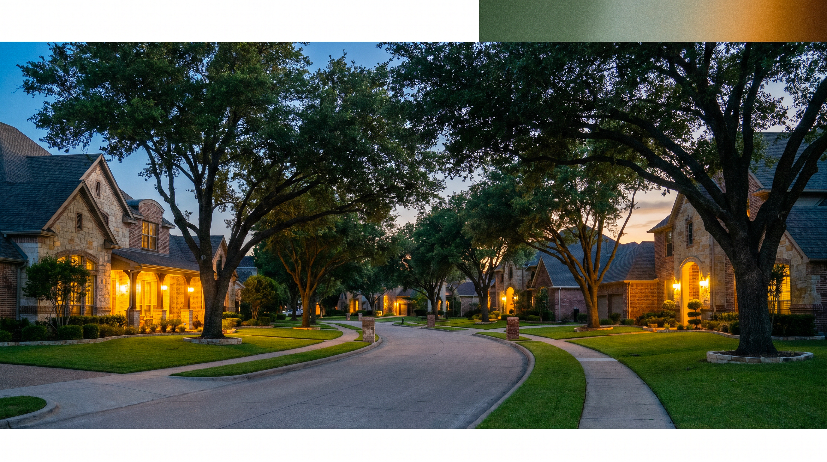 Tree-lined DFW neighborhood street at dusk with warm interior lights glowing through windows of brick homes